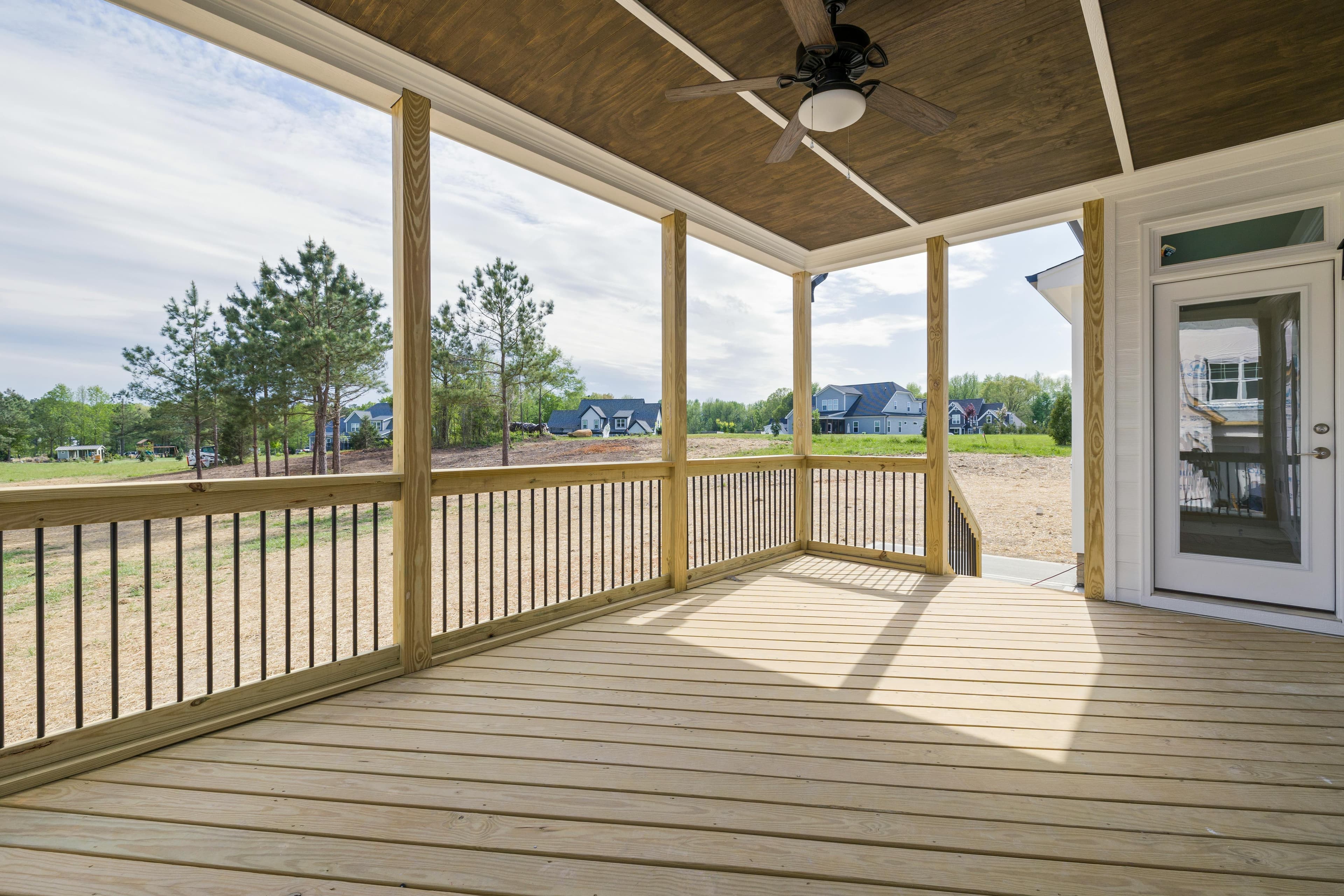 Custom-built deck with patio furniture and outdoor lighting