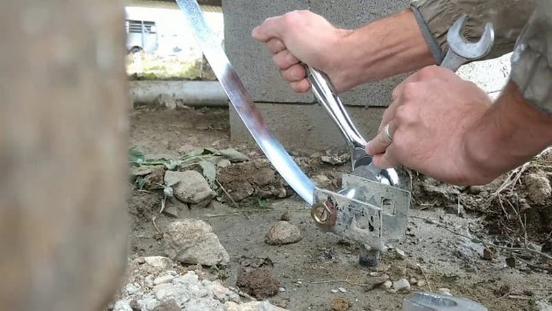 Installing a tie-down anchor strap for a mobile home