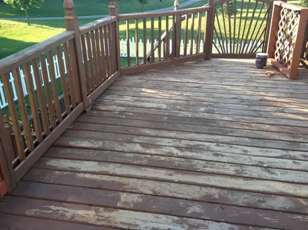 Weathered deck with a worn, faded finish